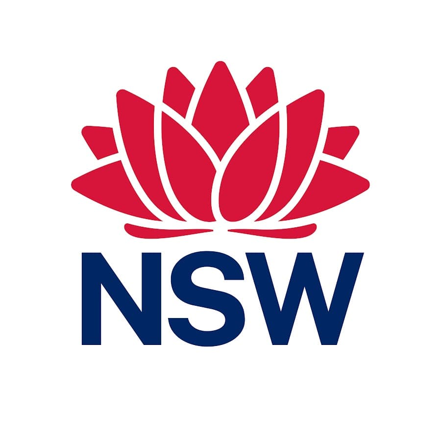 NSW Government logo featuring a red waratah flower emblem on the left, accompanied by text that reads 'Communities & Justice' in blue on the right.