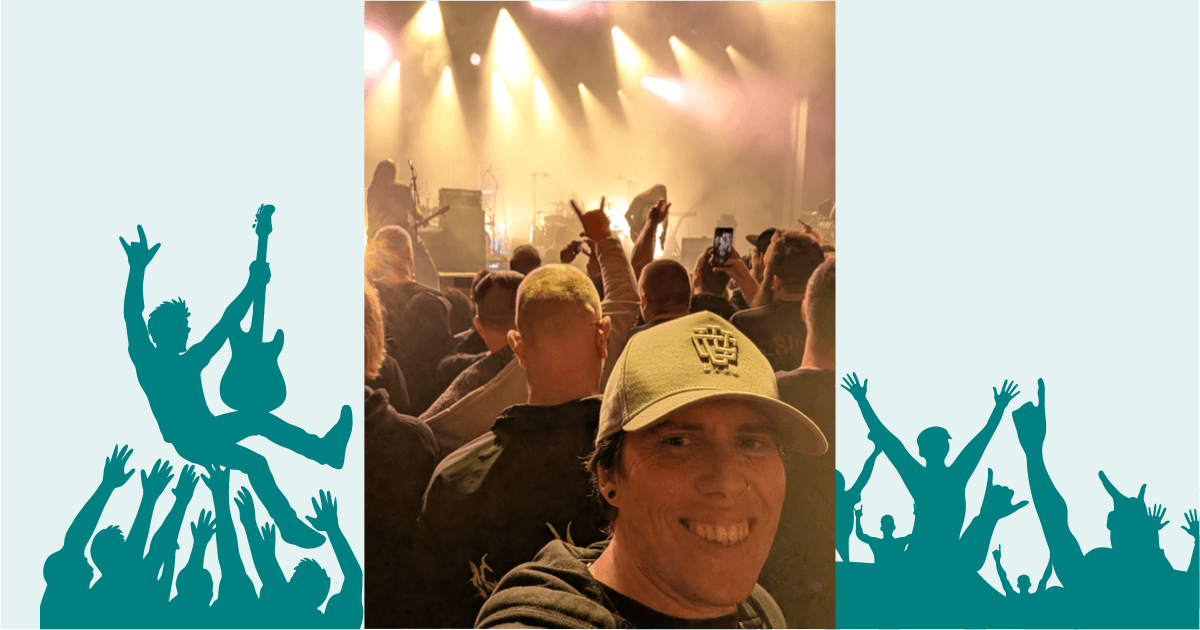 Daniel, See Me Please’s Engagement Lead, smiling in a beige cap while taking a selfie at a live concert, with a crowd cheering and raising their hands behind him under golden stage lights. Teal silhouette illustrations of raised hands and crowd-surfers frame the bottom corners of the image.