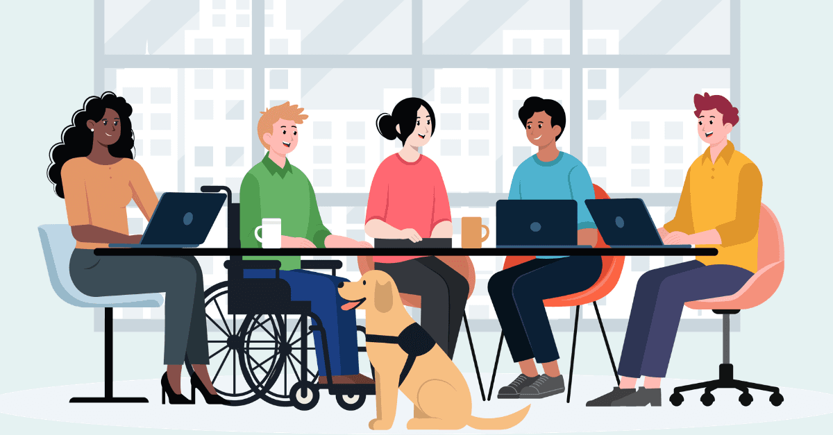 Illustration of five diverse colleagues seated together at a shared desk with laptops and coffee mugs, including a wheelchair user with a guide dog, in conversation in a bright office with a city skyline visible through the windows